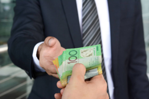 handing over money to suited person -compressed small handing over money to suited person -compressed small